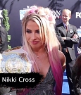 Alexa_Bliss_u0026_Nikki_Cross_Interview_-_WWE_Smackdown_20th_Anniversary_Blue_Carpet_045.jpg